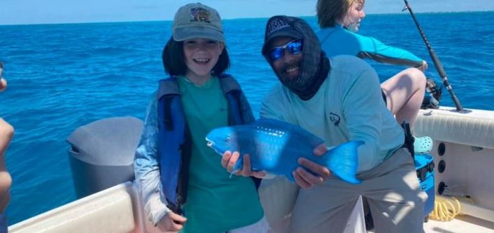 The blue parrot fish made for a happy angler today! The blue parrot fish made for a happy angler today!